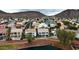 Expansive aerial view capturing a beautiful lake, waterfront homes, and rolling hills in the background at 21474 N 56Th Ave, Glendale, AZ 85308
