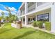 Landscaped backyard with a patio, artificial grass, and potted plants at 21474 N 56Th Ave, Glendale, AZ 85308