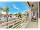 Inviting balcony view overlooking a lush green golf course and serene water feature on a sunny day at 21474 N 56Th Ave, Glendale, AZ 85308