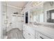 Elegant bathroom with dual sinks, walk-in shower, soaking tub, and custom cabinetry at 21474 N 56Th Ave, Glendale, AZ 85308