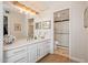 Bathroom featuring a vanity, a large mirror, and a shower at 21474 N 56Th Ave, Glendale, AZ 85308