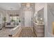 Bright and airy foyer with elegant chandelier, patterned rug, and designer accents at 21474 N 56Th Ave, Glendale, AZ 85308