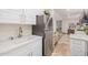 Bright kitchen featuring modern appliances, white cabinetry, and gold hardware at 21474 N 56Th Ave, Glendale, AZ 85308