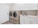 White laundry room with washer and dryer and sink at 21474 N 56Th Ave, Glendale, AZ 85308