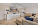 Spacious living room featuring tile floors, built-in cabinets, and cozy seating at 21474 N 56Th Ave, Glendale, AZ 85308