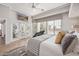 Light-filled main bedroom with large windows overlooking the serene water at 21474 N 56Th Ave, Glendale, AZ 85308
