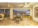 Outdoor patio with a lake view, a table with chairs, and ceiling fans at 21474 N 56Th Ave, Glendale, AZ 85308