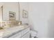 Chic powder room with elegant marble countertop and stylish fixtures at 21474 N 56Th Ave, Glendale, AZ 85308