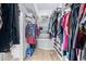 Organized walk-in closet with shelving for clothes, shoes and accessories at 21474 N 56Th Ave, Glendale, AZ 85308