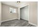 Cozy bedroom with a window and a closet featuring rod for hanging items at 2221 E Lynne Ln, Phoenix, AZ 85042
