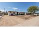 Charming single-story home with a spacious front yard and mature tree at 2221 E Lynne Ln, Phoenix, AZ 85042