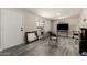 Inviting living area with neutral walls, a window with blinds, and laminate floors at 2221 E Lynne Ln, Phoenix, AZ 85042