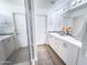 Bathroom with double vanity, shower, and modern lighting at 2314 E Hidalgo Ave, Phoenix, AZ 85040
