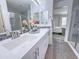 A bathroom showcasing a double vanity with modern sinks and stylish decor at 2314 E Hidalgo Ave, Phoenix, AZ 85040