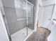 Clean bathroom showcasing a shower and a double vanity setup with a modern design at 2314 E Hidalgo Ave, Phoenix, AZ 85040
