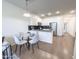Charming dining area with a modern table and chairs, perfect for intimate meals and gatherings at 2314 E Hidalgo Ave, Phoenix, AZ 85040