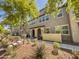 Attractive multi-story townhome with well-maintained landscaping and inviting front entry at 2314 E Hidalgo Ave, Phoenix, AZ 85040