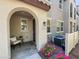 Charming front porch with seating area and well-maintained landscaping at a townhome entrance at 2314 E Hidalgo Ave, Phoenix, AZ 85040