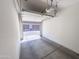 A clean, empty garage with concrete floor awaits your vehicle and storage needs at 2314 E Hidalgo Ave, Phoenix, AZ 85040