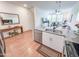 Stylish kitchen with granite countertops, stainless steel appliances, and a view into the open-concept living area at 2314 E Hidalgo Ave, Phoenix, AZ 85040