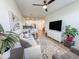 Bright living room with a neutral color palette, modern decor, and an open view to the kitchen and dining area at 2314 E Hidalgo Ave, Phoenix, AZ 85040