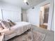 Serene bedroom with neutral tones, plush carpet, and ample closet space for a peaceful retreat at 2314 E Hidalgo Ave, Phoenix, AZ 85040