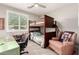 Cozy bedroom showcasing a bunk bed, desk, chair and reading chair at 2553 E Carob Dr, Gilbert, AZ 85298