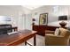 An office space with a wooden desk, chair, and traditional decor at 2553 E Carob Dr, Gilbert, AZ 85298