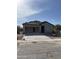 New home construction with a concrete driveway and in-progress roof at 25714 N Boreas Rd, Florence, AZ 85132