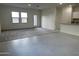 Bright living room featuring tile flooring and large windows for natural light at 25714 N Boreas Rd, Florence, AZ 85132