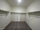 Spacious walk-in closet with shelving, and carpeted floor at 25714 N Boreas Rd, Florence, AZ 85132
