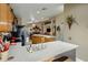 Open concept kitchen with modern appliances, a central island, and seamless flow into living spaces at 25821 N 41St Dr, Phoenix, AZ 85083