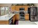 Well-equipped kitchen featuring stainless steel appliances, granite countertops, and plenty of storage space at 25821 N 41St Dr, Phoenix, AZ 85083