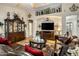 Comfortable living room with hardwood floors, stylish decor, a large TV, and ample seating for guests at 25821 N 41St Dr, Phoenix, AZ 85083
