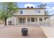 Spacious backyard with a covered patio, grill, firepit, and shade trees at 2619 S Los Altos --, Mesa, AZ 85202
