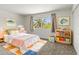 Inviting bedroom with palm tree view, and colorful accents at 2619 S Los Altos --, Mesa, AZ 85202