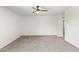 Clean and bright bedroom with a ceiling fan, neutral carpet, and ample natural light at 2619 S Los Altos --, Mesa, AZ 85202