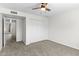 Bedroom with a ceiling fan, neutral carpet, and a closet at 2619 S Los Altos --, Mesa, AZ 85202