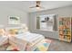 Bright bedroom featuring a white bed frame, colorful rug, and a window view at 2619 S Los Altos --, Mesa, AZ 85202