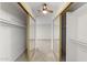Walk-in closet with shelving and mirrored doors leading to the bedroom at 2619 S Los Altos --, Mesa, AZ 85202