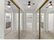 Walk-in closet with mirrored doors leading to an ensuite bathroom at 2619 S Los Altos --, Mesa, AZ 85202