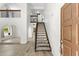 Bright and inviting foyer with a staircase and wood-look tile flooring throughout at 2619 S Los Altos --, Mesa, AZ 85202