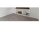 Bright hallway features neutral carpet, white walls, and railing overlooking front entrance at 2619 S Los Altos --, Mesa, AZ 85202