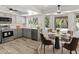 Updated kitchen with gray cabinetry, stainless steel appliances, and a view of the backyard pool at 2619 S Los Altos --, Mesa, AZ 85202