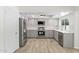 Modern kitchen featuring stainless steel appliances, gray cabinets, white backsplash, and a ceiling fan at 2619 S Los Altos --, Mesa, AZ 85202