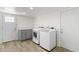 Convenient laundry area with modern washer and dryer units and storage at 2619 S Los Altos --, Mesa, AZ 85202
