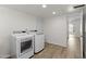 Bright laundry room with modern washer and dryer and wood look flooring at 2619 S Los Altos --, Mesa, AZ 85202