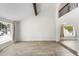 Expansive living room featuring an open layout, wood-look tile, and an abundance of natural light at 2619 S Los Altos --, Mesa, AZ 85202