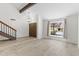 Open and airy living room showcases wood-look tile flooring, and a large window at 2619 S Los Altos --, Mesa, AZ 85202