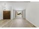 Bright living room with wood-look floors, a large window, and a stylish light fixture at 2619 S Los Altos --, Mesa, AZ 85202